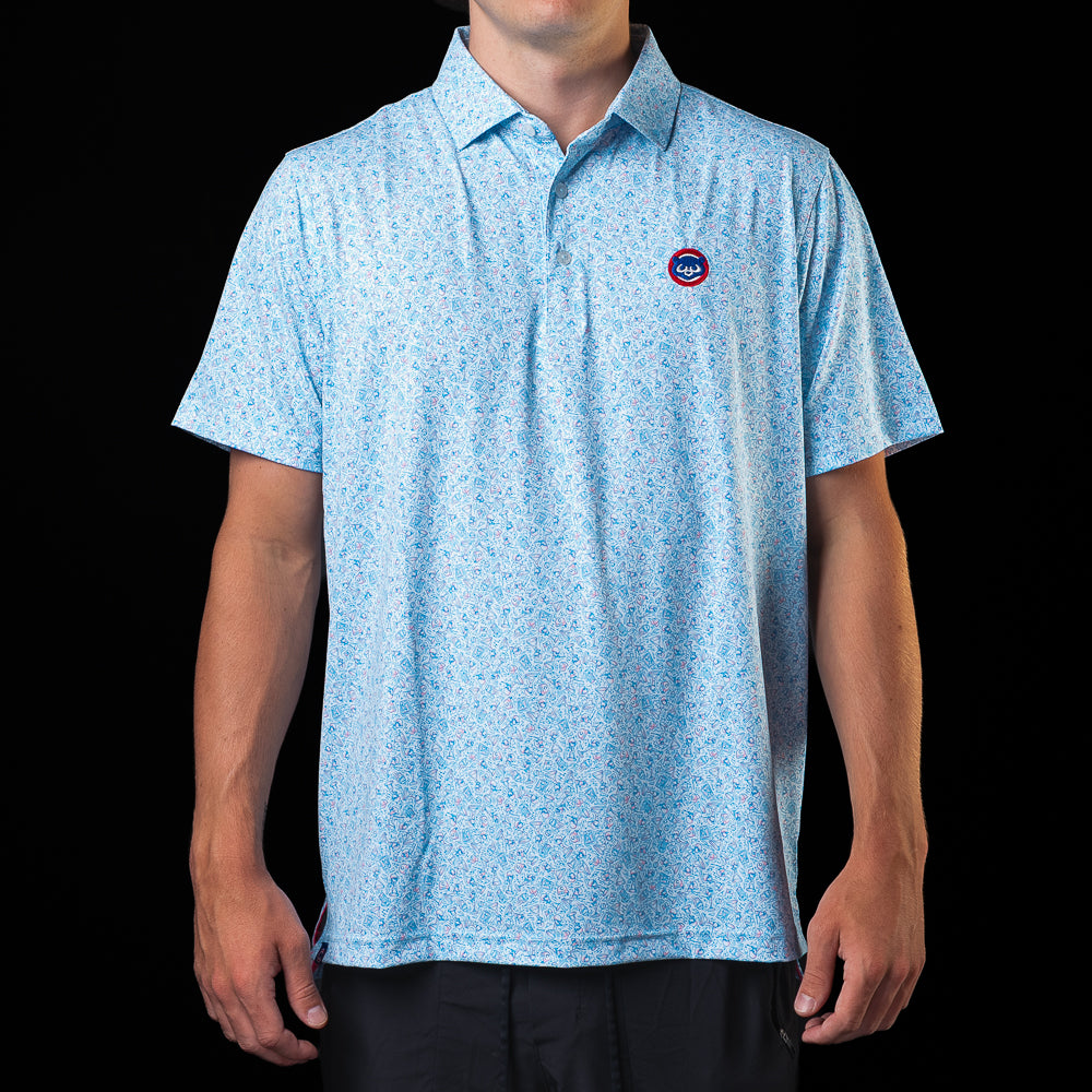 SWAG Golf Chicago Cubs Bobblehead Classic Polo Shirt in light blue with all-over Cubs-inspired graphics and embroidered Cubs chest logo.