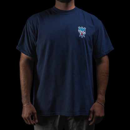 Person wearing a SWAG Golf navy blue short sleeve graphic t-shirt with a tattoo themed logo on the chest against a black background