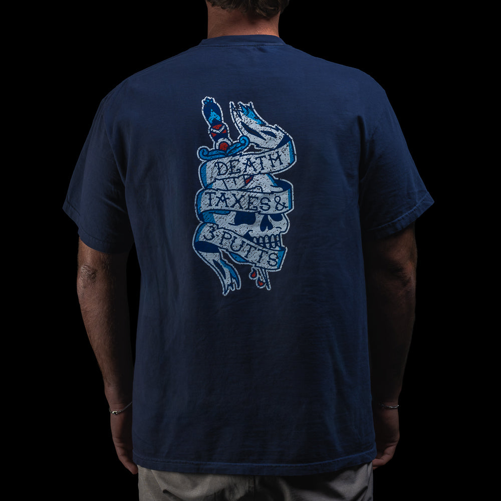 Person wearing a SWAG Golf navy blue short sleeve graphic t-shirt with a tattoo themed logo on the chest against a black background