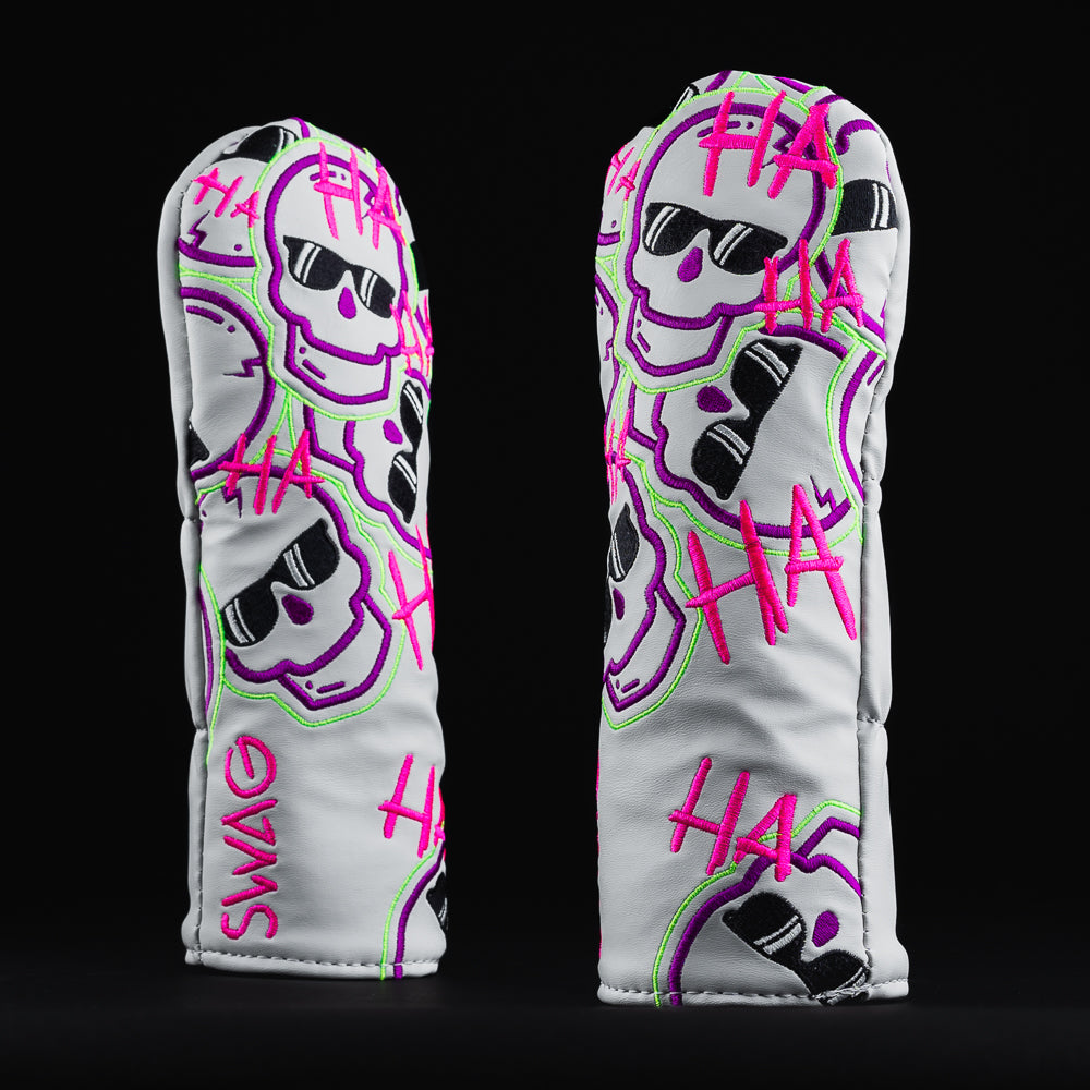Defaced falling skulls white, purple, pink and green hybrid wood golf head cover made in the USA.
