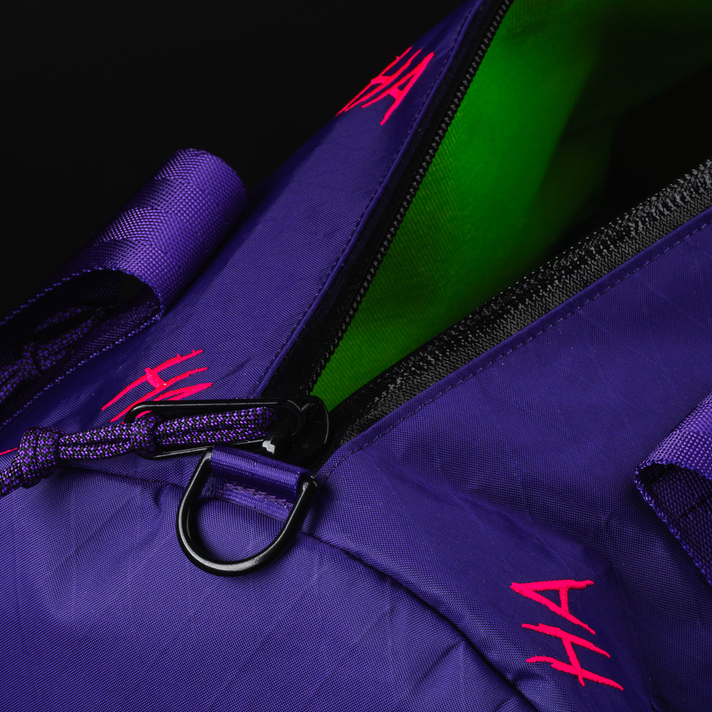 Swag x Defy Defaced Franklin ultimate overnighter purple duffel bag.