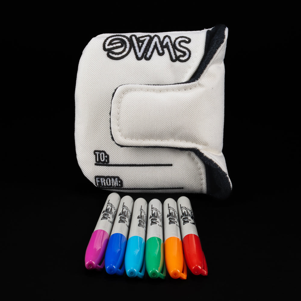 White golf headcover accompanied by markers and a 'SWAG' gift card on a black background.