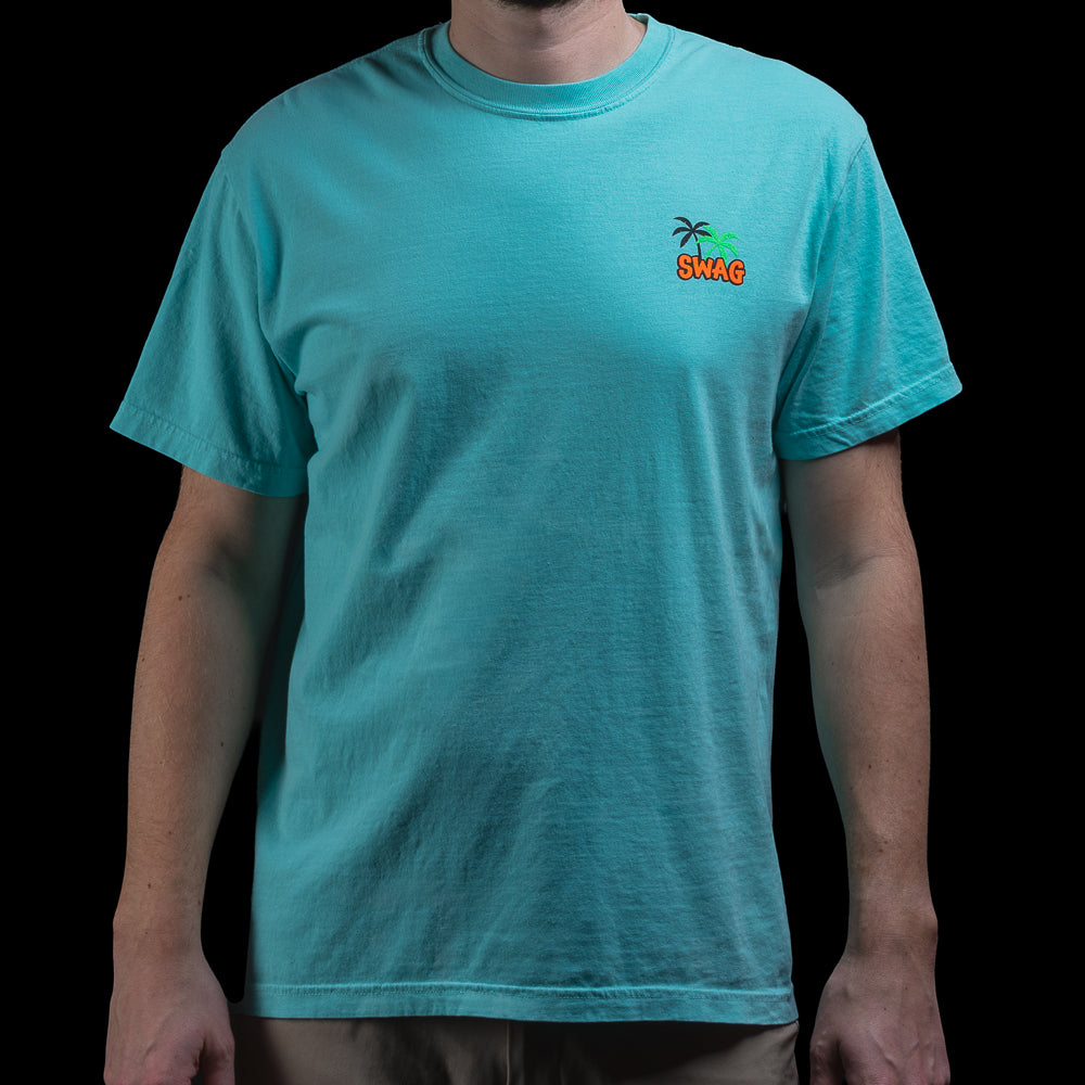 Front view of aqua Pelican T-Shirt with small palm tree SWAG logo on left chest and relaxed fit silhouette.
