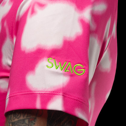 SWAG Golf x G/FORE men's performance golf polo shirt with pink and white floral pattern and a peach skull logo over the left chest.
