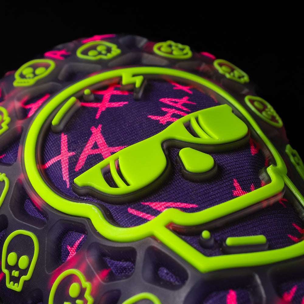 SWAG Purple TPU Defaced Skull golf headcover with neon green and neon pink accents.