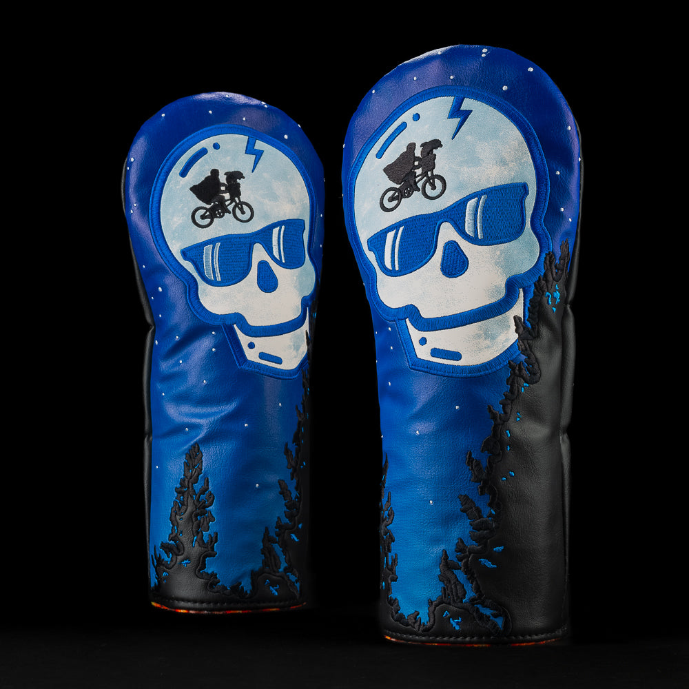 Phone Home Driver headcover with a blue night sky and black trees and moon pattern skull. 