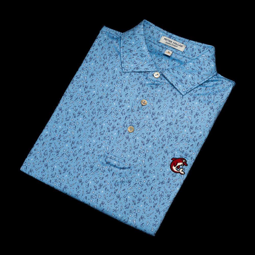 SWAG x Peter Millar blue men's golf polo with animal and cocktail print with red flipper. 