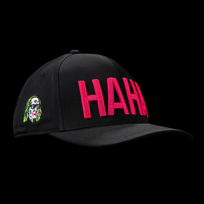 G/Fore flexfit 110 black golf cap with pink 'HAHA' text.