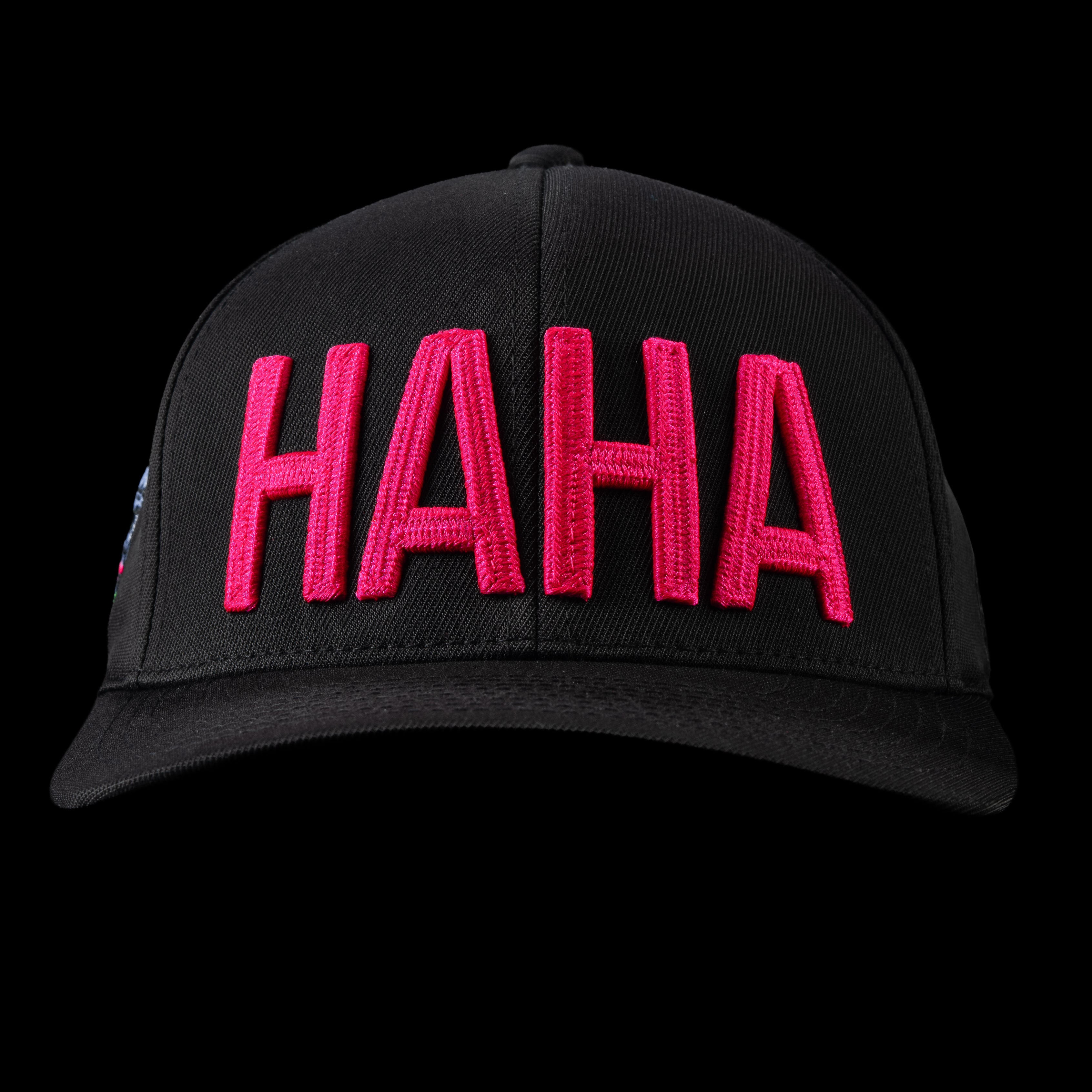 G/Fore flexfit 110 black golf cap with pink 'HAHA' text.