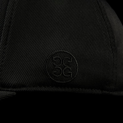 G/Fore flexfit 110 black golf cap with pink 'HAHA' text.