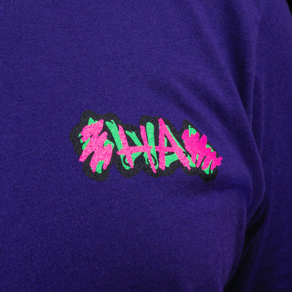 Purple SWAG t-shirt with neon joker skull king graphic and graffiti HA scribbles on the back.