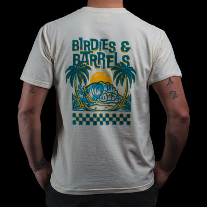 Back view of cream Birdies & Barrels SWAG Golf t-shirt featuring “Birdies & Barrels” Hawaii graphic with palm trees, waves, and sunset.
