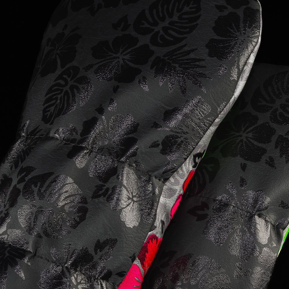 Close up shot of the Floral Skull Wood Cover Set. On a black backdrop with contrasting black florals. 