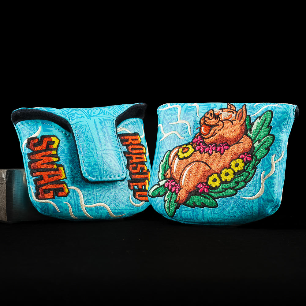 SWAG Golf Pig Roast mallet putter cover with roasted pig artwork, tropical details, and bold blue design.