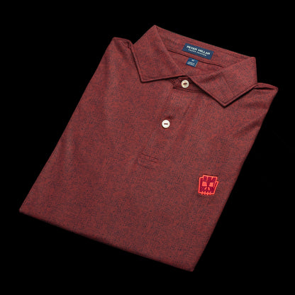 SWAG Golf x Peter Millar men's short sleeve performance golf polo shirt with tiki logo on left chest.