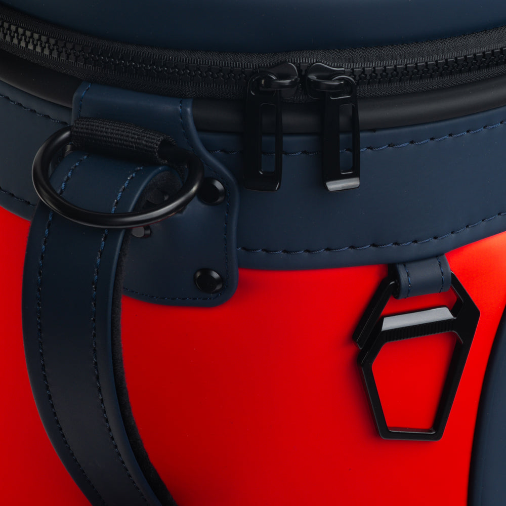 Close-up of the Houston Texans Den Caddy Cooler zipper, handle, and navy and red panels.