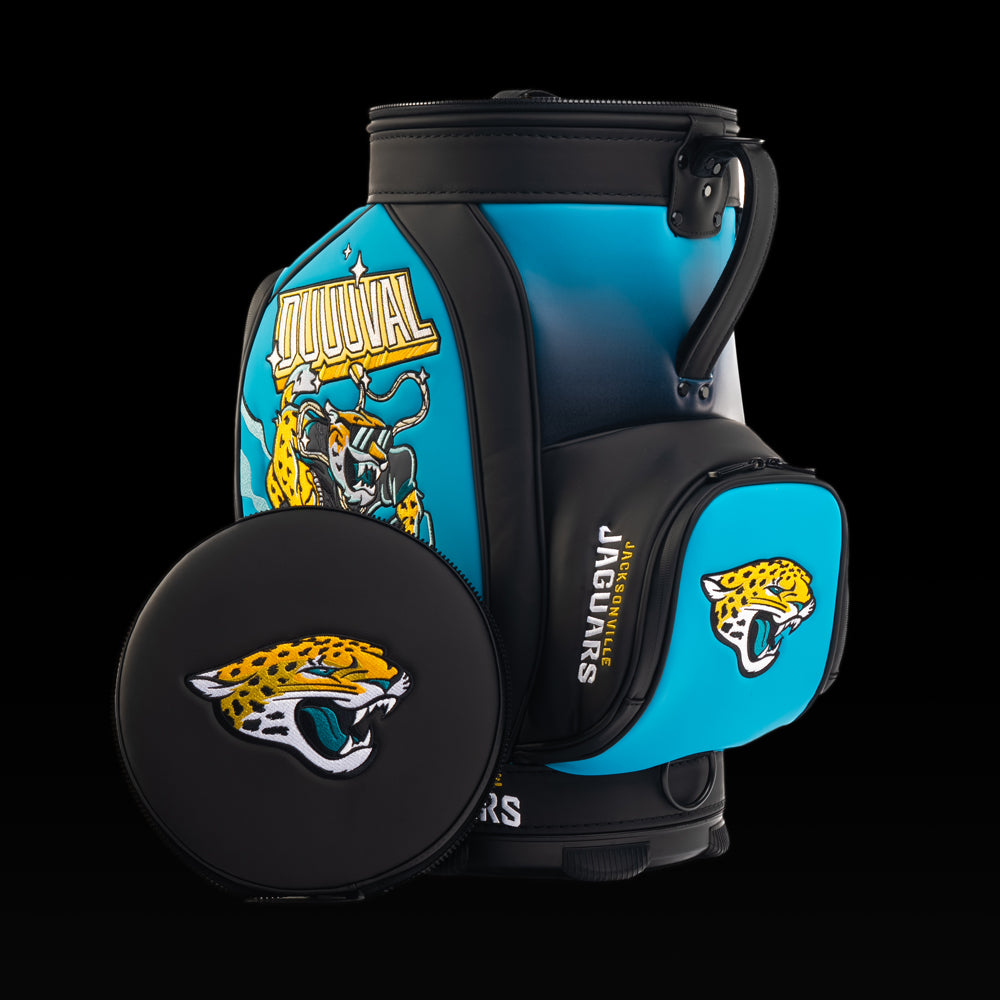 Jacksonville Jaguars Den Caddy Cooler displayed with the removable embroidered lid beside the cooler.