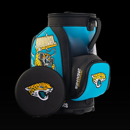 Jacksonville Jaguars Den Caddy Cooler displayed with the removable embroidered lid beside the cooler.