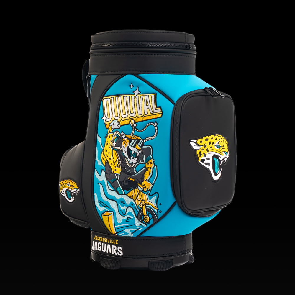 Angled view of the SWAG Golf Jacksonville Jaguars Den Caddy Cooler showcasing the "Duuuval" artwork and embroidered Jaguars logo pocket.