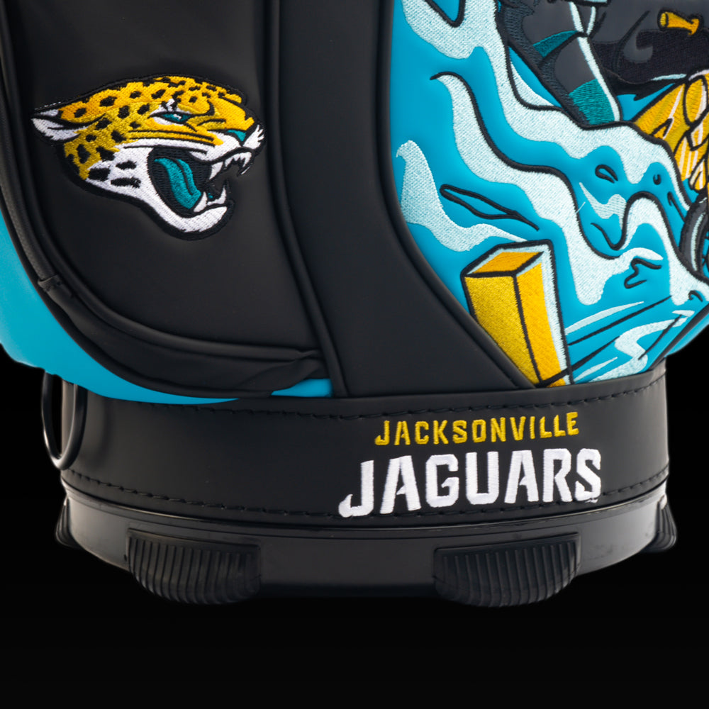 Close-up of the embroidered Jaguars logo on the front pocket with the "Duuuval" artwork in the background.
