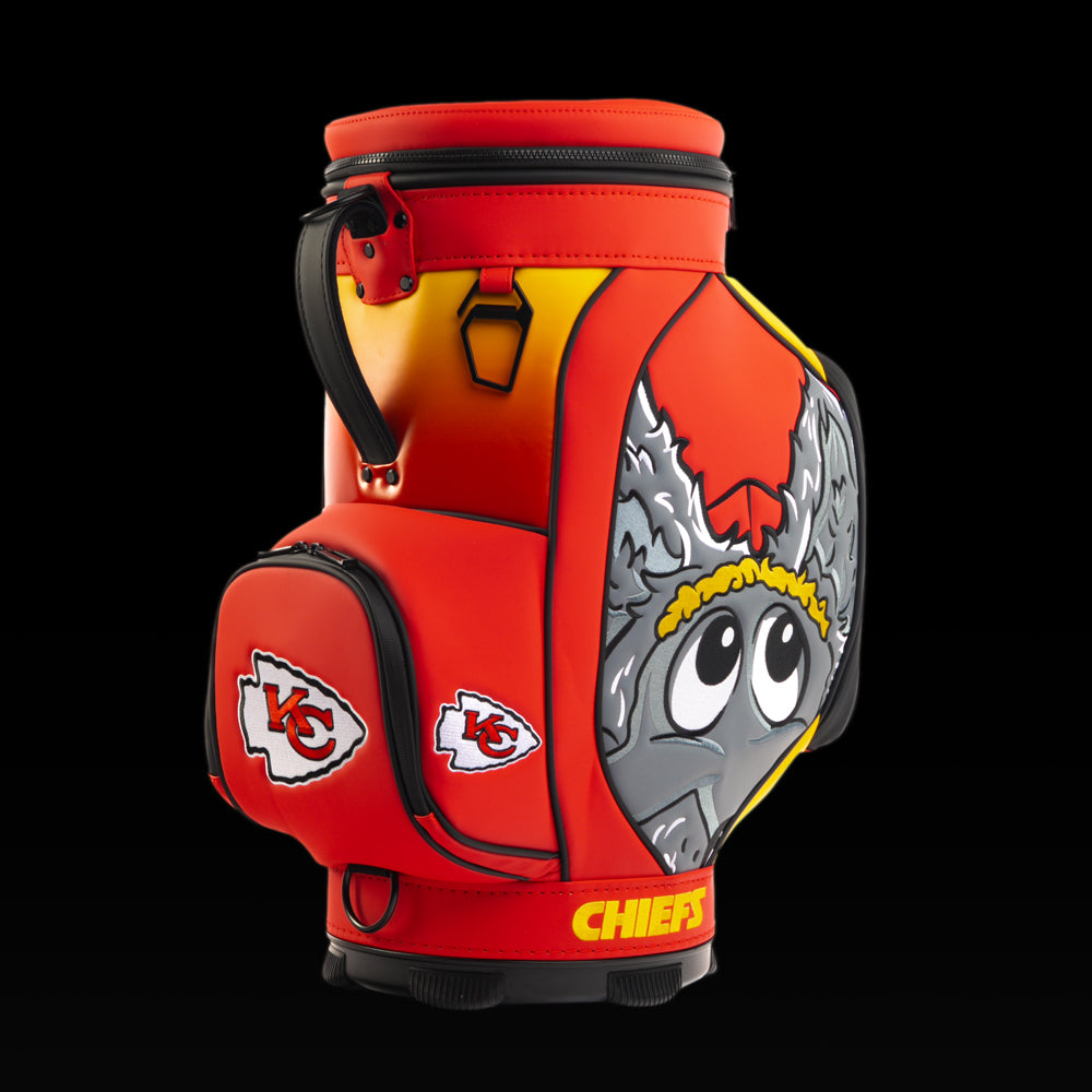 Angled view of the SWAG Golf Kansas City Chiefs Den Caddy Cooler showcasing the cartoon wolf artwork and embroidered Chiefs logo pocket.