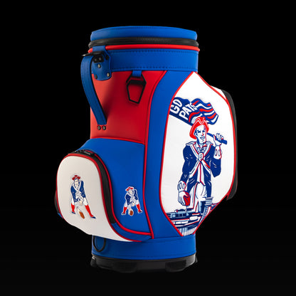 Angled view of the SWAG Golf New England Patriots Den Caddy Cooler showcasing the vintage Pat Patriot artwork and embroidered Patriots logo pocket.