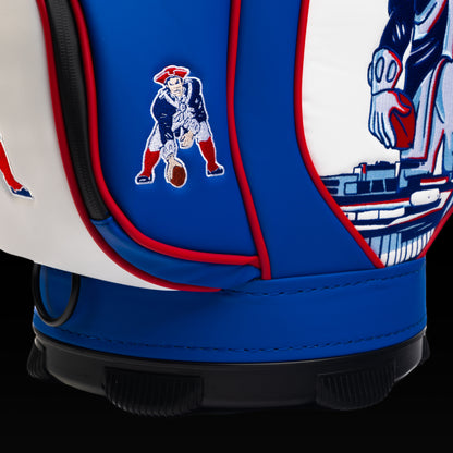 Close-up of the embroidered Pat Patriot logo on the front pocket with the vintage mascot artwork in the background.