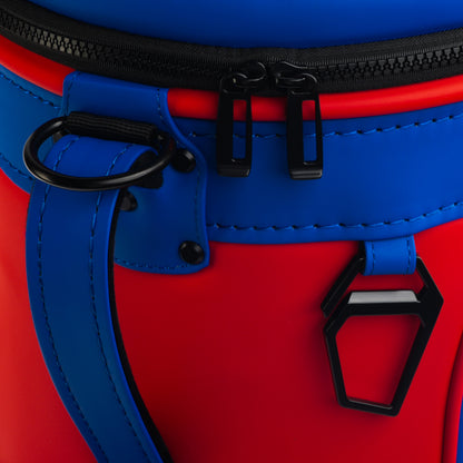 Close-up of the New England Patriots Den Caddy Cooler zipper, handle, and red and blue panels.