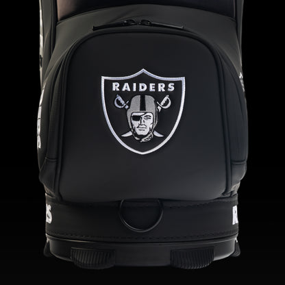 Close-up view of the SWAG Golf Las Vegas Raiders Den Caddy Cooler with an embroidered Raiders shield on the front pocket.