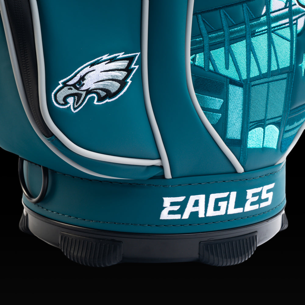 Close-up of the embroidered Eagles logo on the front pocket with the Eagle mascot artwork in the background.