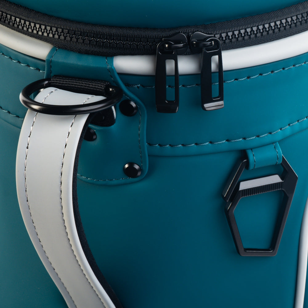 Close-up of the Philadelphia Eagles Den Caddy Cooler zipper, handle, and midnight green panels.