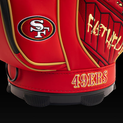 Close-up of the embroidered 49ers logo on the front pocket with the vintage Gold Rush artwork in the background.