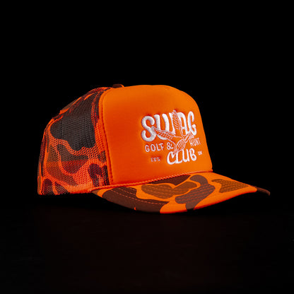 SWAG Hunt Club orange camo foam trucker hat with flying duck graphic and white SWAG logo.