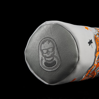 Close-up of Dropzone Light Driver Headcover featuring embossed SWAG skull pull-tab logo in metallic gray leather.