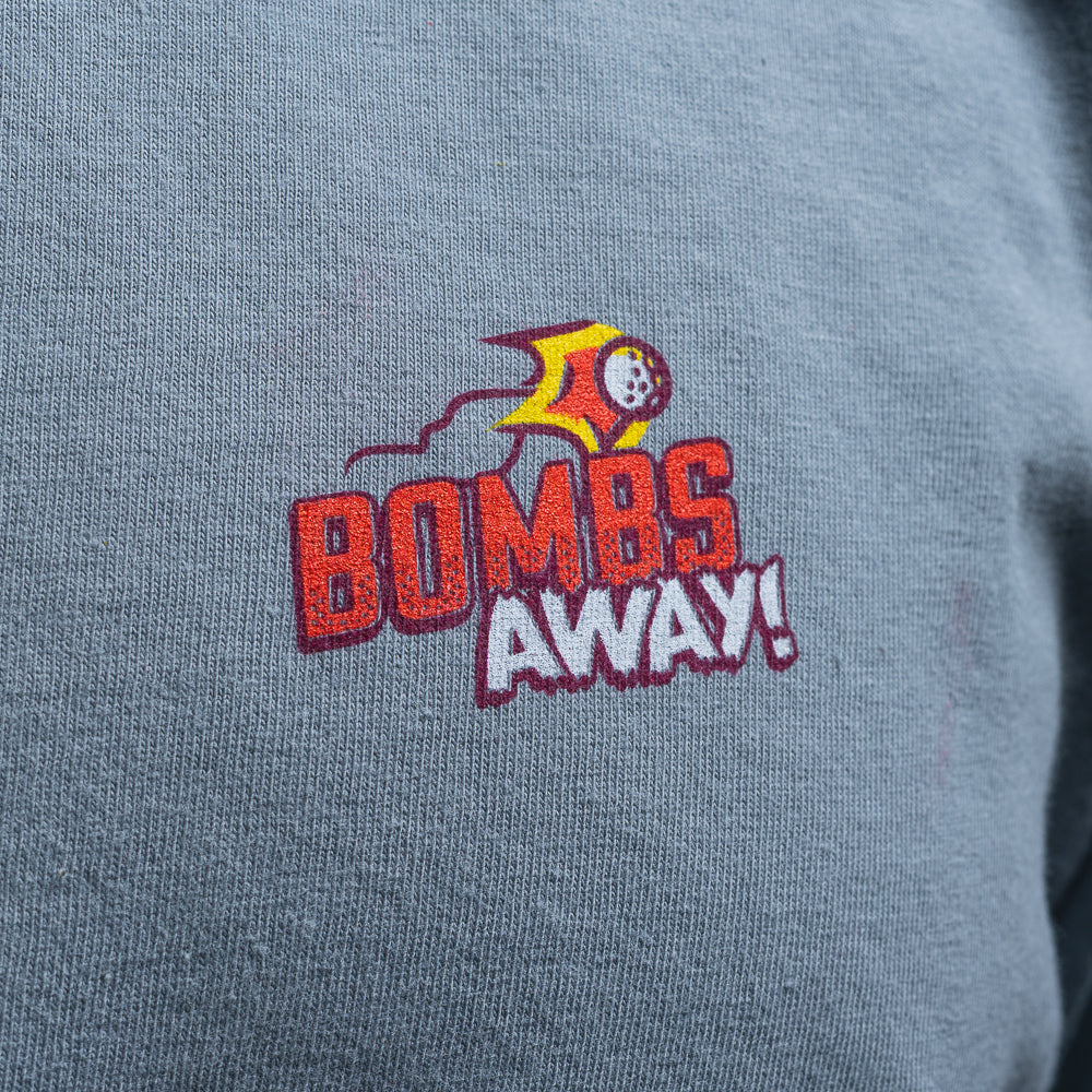 SWAG Golf Bombs Away! grey comfort colors short sleeve heavyweight graphic print t-shirt with vintage bomber plane comic book scene.
