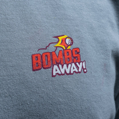 SWAG Golf Bombs Away! grey comfort colors short sleeve heavyweight graphic print t-shirt with vintage bomber plane comic book scene.