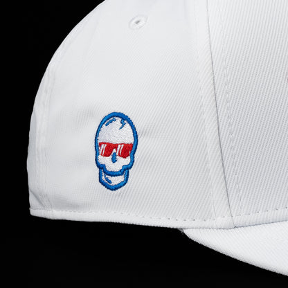 Close-up detail of the 1776 hat featuring an embroidered patriotic skull logo on the side panel of the white cap.