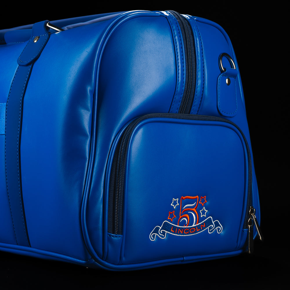 Rear side view of the RWB Gigantic Lincoln Duffel Bag displaying commemorative patriotic details, zippered compartments, and durable travel-ready construction.