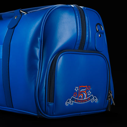 Rear side view of the RWB Gigantic Lincoln Duffel Bag displaying commemorative patriotic details, zippered compartments, and durable travel-ready construction.