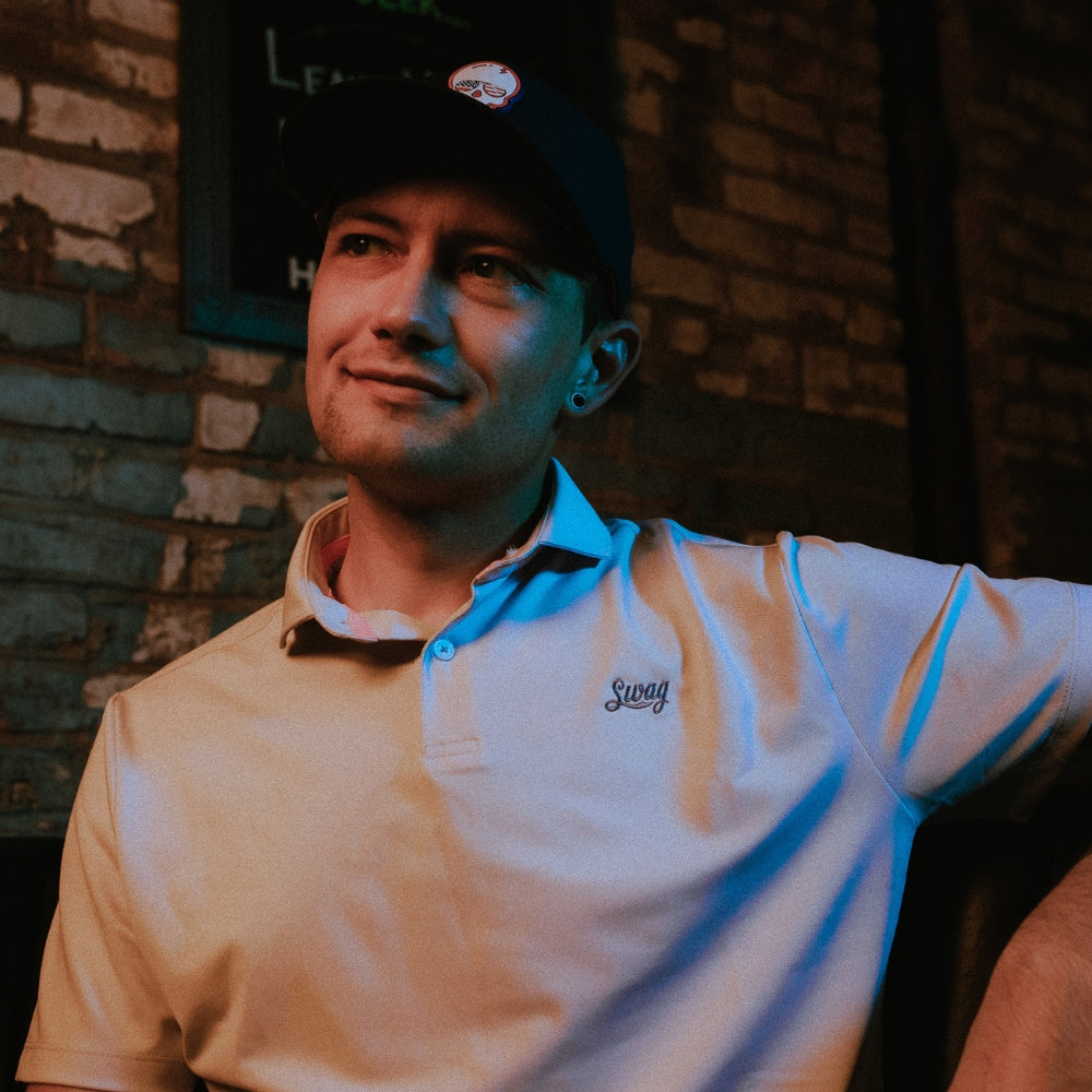 SWAG Golf Lavender Script Tech Polo featuring a clean lavender colorway, lightweight performance fabric, and understated embroidered SWAG Script logo.