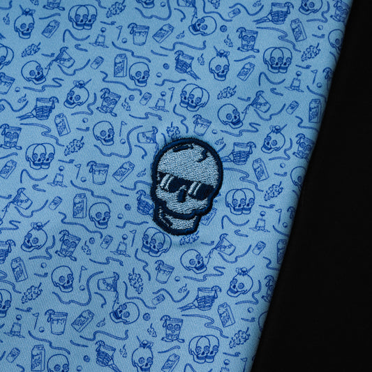 Blue polo with drinking designs with blue skull on the left chest.