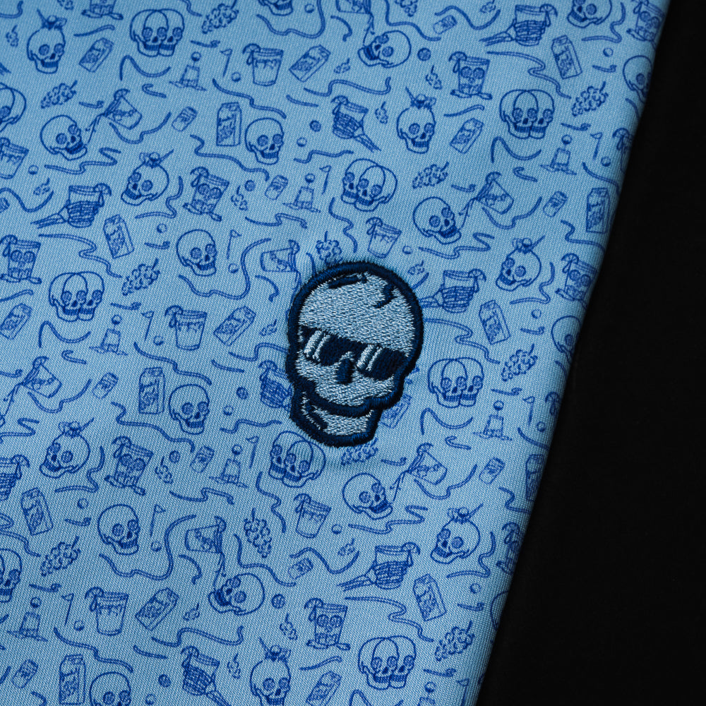 Blue polo with drinking designs with blue skull on the left chest.