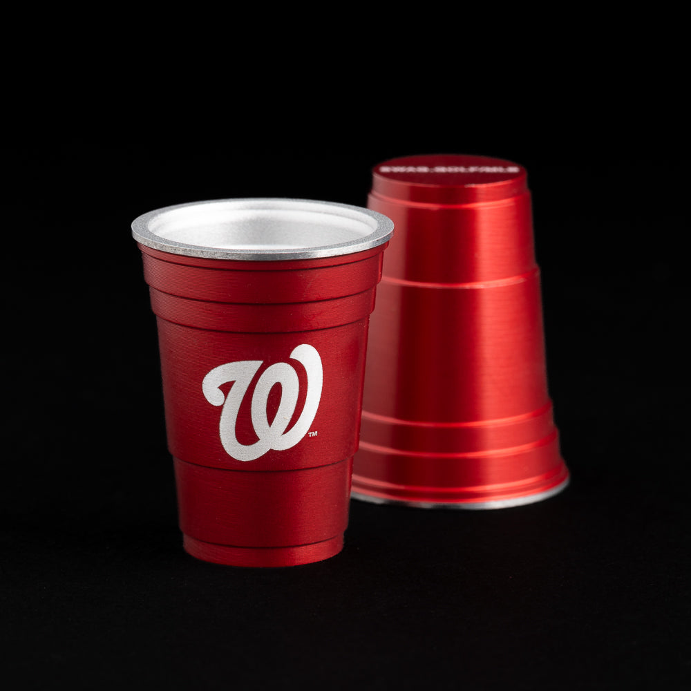 Red flip cup ball marker with the Washington Nationals logo.