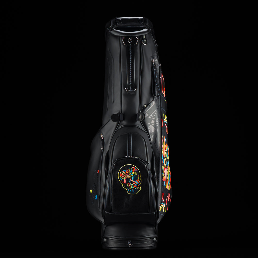 SWAG Golf x Vessel Lux Stand Bag with King playing card blackout and neon pops of color. 