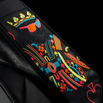 SWAG Golf x Vessel Lux Stand Bag with King playing card blackout and neon pops of color. 