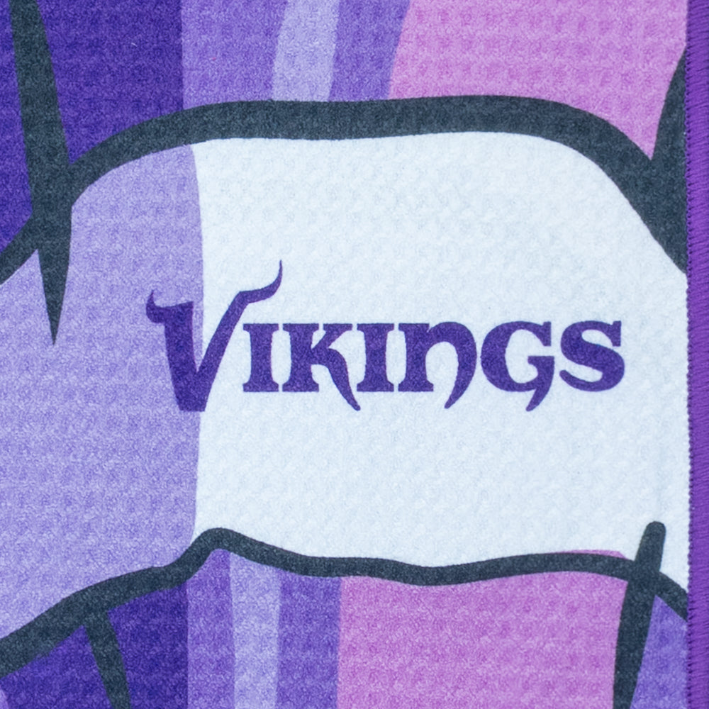 NFL Minnesota Vikings purple and yellow golf towel with a cartoonish depiction of a character holding a helmet, featuring the word 'Vikings'.