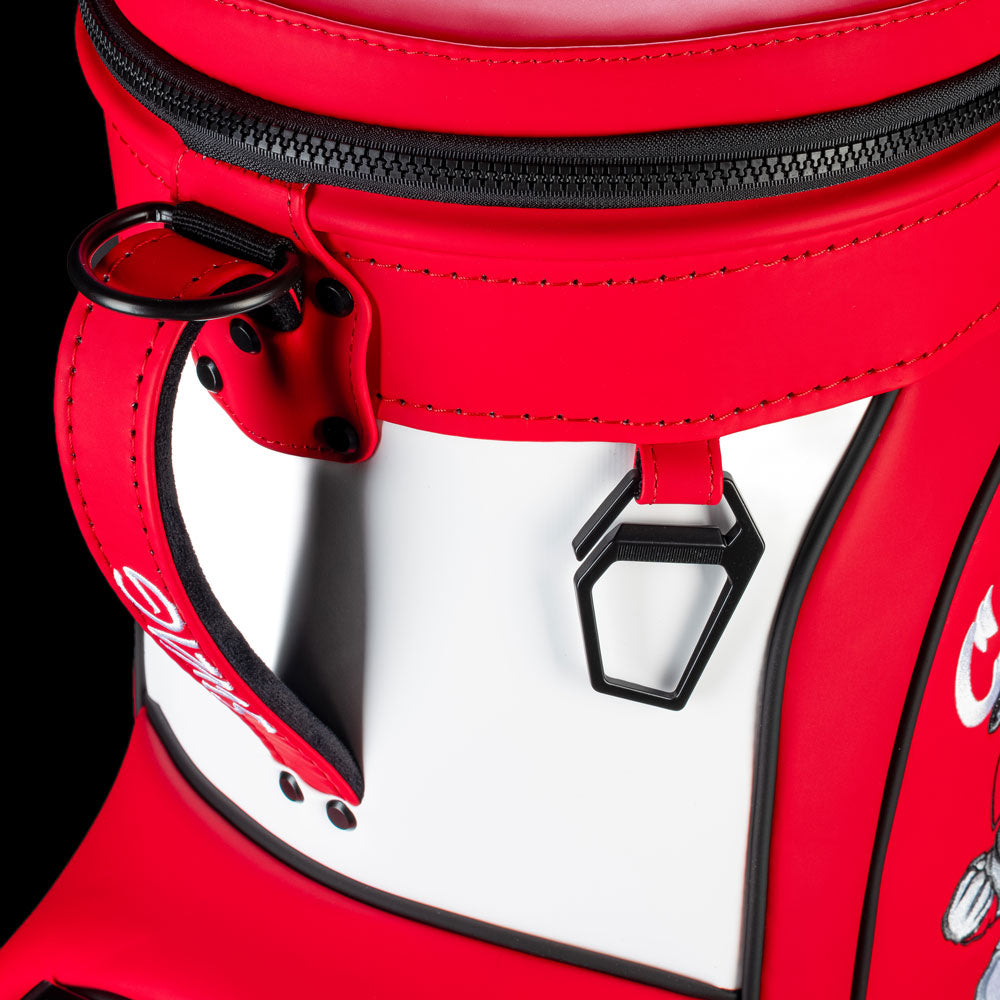 Alabama Crimson Tide Den Caddy Cooler close-up featuring crimson trim, white panel, SWAG zipper pull, and metal bottle opener