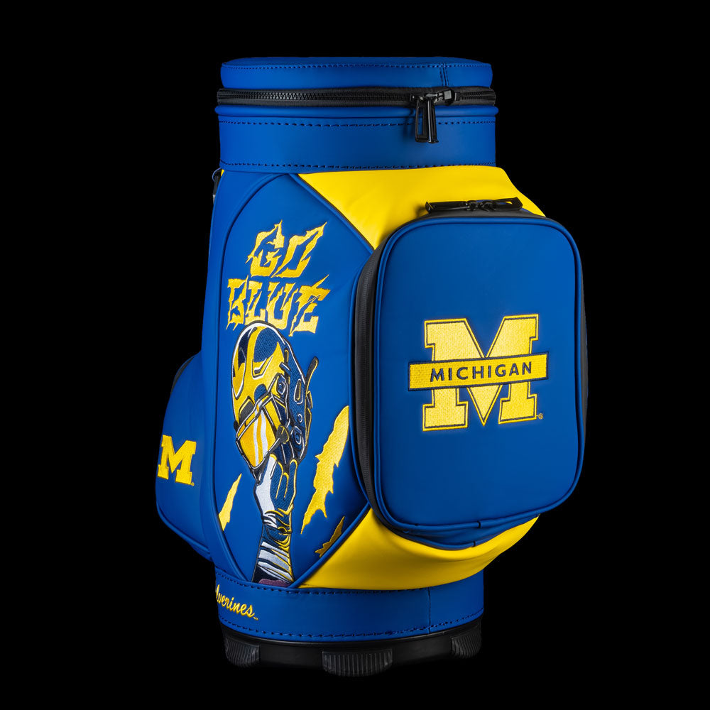 Michigan Wolverines Go Blue Den Caddy Cooler featuring Wolverine mascot artwork, Go Blue lettering, and block M front pocket