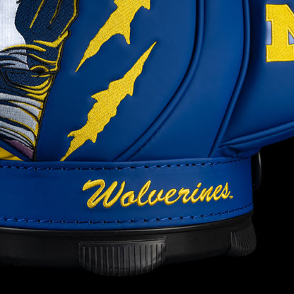 Michigan Wolverines Go Blue Den Caddy Cooler detail featuring maize claw marks, Wolverines script, and blue paneling