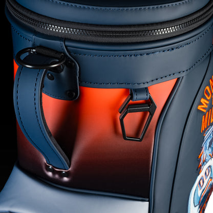 Close-up of the Chicago Bears Den Caddy Cooler zipper, handle, and navy and orange panels.